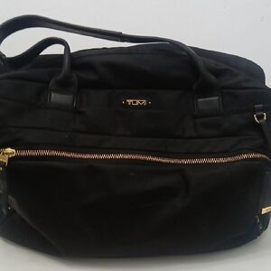 Tumi Black Travel Bag with Gold Accents
